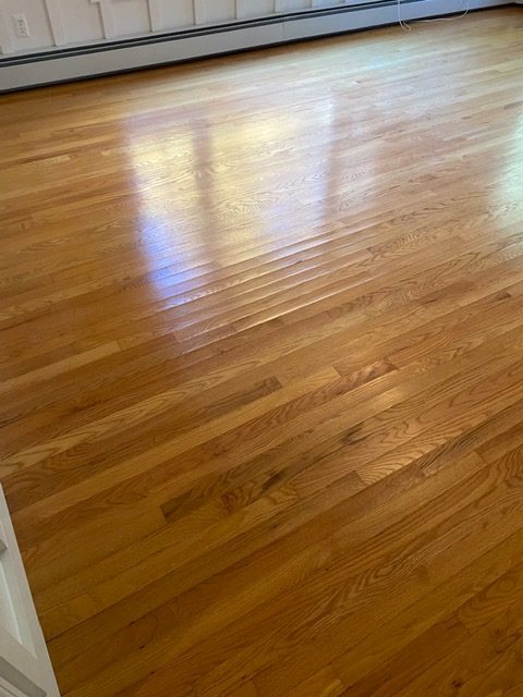 Badly cupped floors in Harvard caused by a leaking refrigerator water line now sanded and refinished back to their original smooth self again!
Resurfaced a warped wood floor in Harvard, MA.

