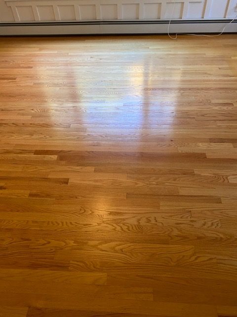 Badly cupped floors in Harvard caused by a leaking refrigerator water line now sanded and refinished back to their original smooth self again!
Resurfaced a warped wood floor in Harvard, MA.

