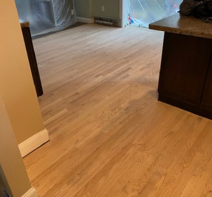 Kitchen floor sanded, stained, and refinished in Burlington