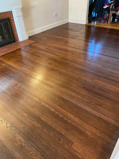 <!-- wp:paragraph -->
<p>Client in Belmont with old, high trafficked floors needed a refinish, but I suggested doing a darker stain to “hide” the badly damaged water worn areas that I figured would still look “cloudy”.  They agreed and the results speak for themselves!</p>
<!-- /wp:paragraph -->