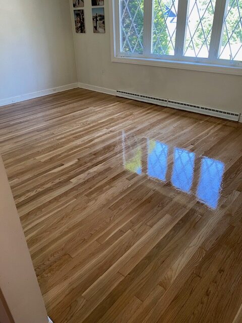 Homeowner in Billerica needed their living room, floor, sanded and refinished before bringing home a new set of twins!
