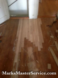 FIxing a wood floor in BIllerica, MA by Mark's Master Service